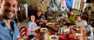 Group of visitors having an amazing meal while Marino takes a selfie of them all